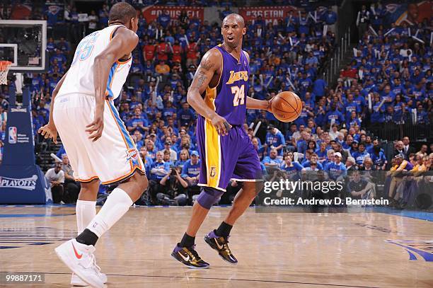 Kobe Bryant of the Los Angeles Lakers dribbles against Kevin Durant of the Oklahoma City Thunder in Game Six of the Western Conference Quarterfinals...