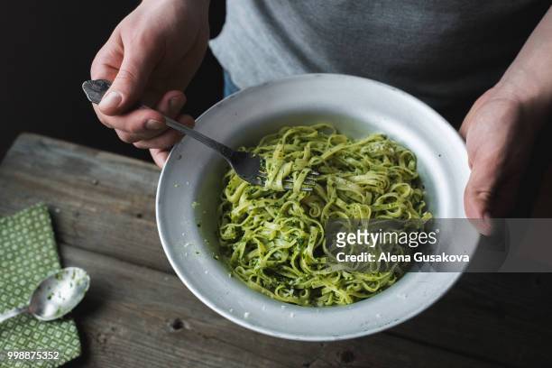 pasta with pesto from parsley and nuts - pesto stock pictures, royalty-free photos & images