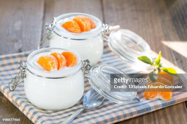 natural yogurt of mandarins - flora gonzalez stock pictures, royalty-free photos & images