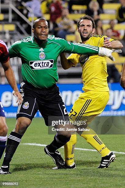 Goalkeeper Zach Thornton of Chivas USA jostles for position with Adam Moffat of the Columbus Crew on May 15, 2010 at Crew Stadium in Columbus, Ohio.