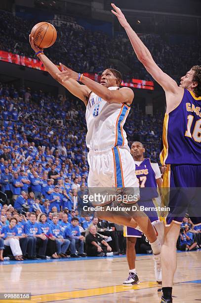 Russell Westbrook of the Oklahoma City Thunder goes to the basket against Pau Gasol of the Los Angeles Lakers in Game Six of the Western Conference...