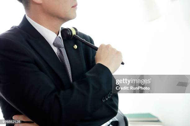 close up of lawyer holding gavel - historical document ストックフォトと画像