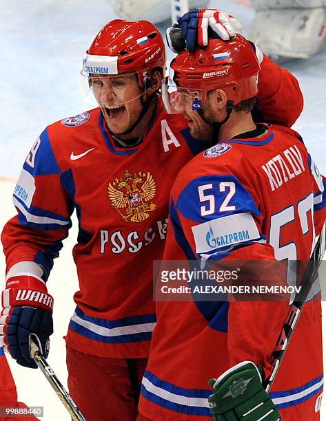 Russia's Sergei Fedorov and Viktor Kozlov celebrate scoring against team Finland during a qualification round match of the IIHF International Ice...