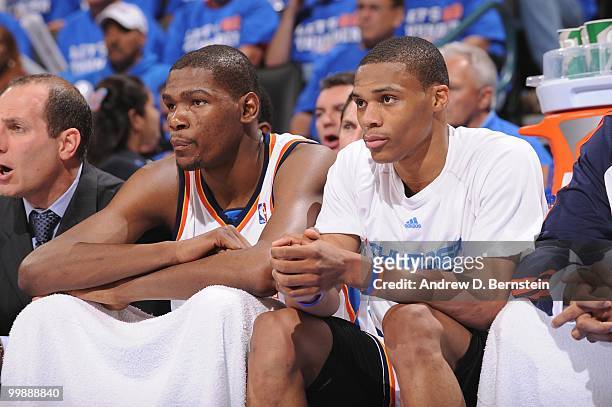 Kevin Durant and Russell Westbrook of the Oklahoma City Thunder sit on the bench during the game against the Los Angeles Lakers in Game Six of the...
