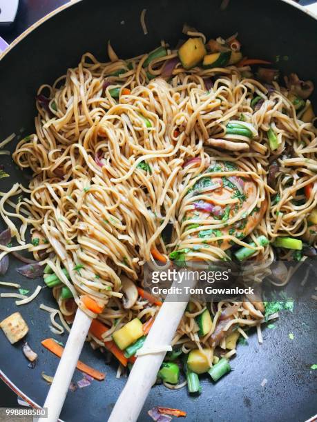 stir fry noodles - stir frying european stock pictures, royalty-free photos & images