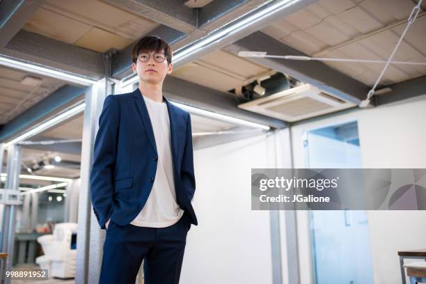 portrait of a confident young businessman - jgalione stock pictures, royalty-free photos & images