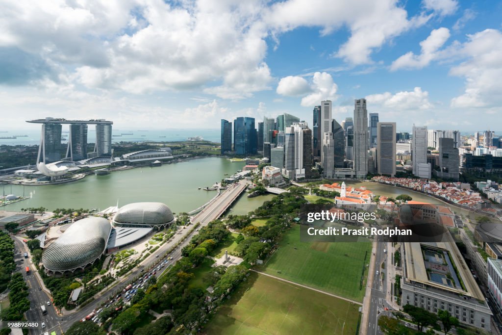 Aerial view of Singapore business district and city at twilight