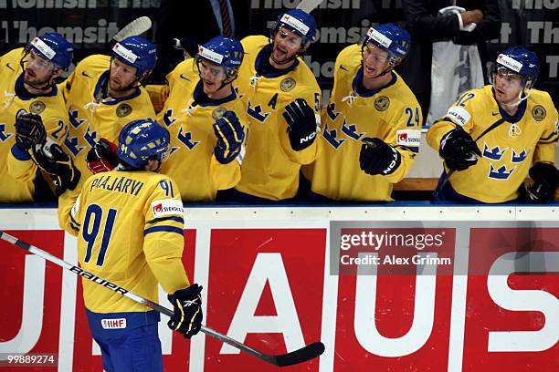 Magnus Paajarvi Svensson of Sweden celebrates his team's first goal with team mates during the IIHF World Championship group E qualification round...