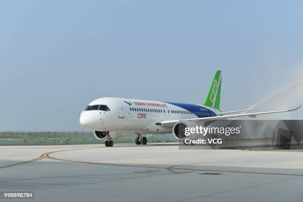 The No.102 C919 passenger jet lands at Dongying Shengli Airport on July 12, 2018 in Dongying, Shandong Province of China. Flying from the final...