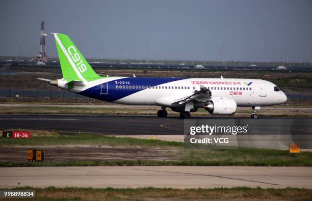 The No.102 C919 passenger jet lands at Dongying Shengli Airport on July 12, 2018 in Dongying, Shandong Province of China. Flying from the final...