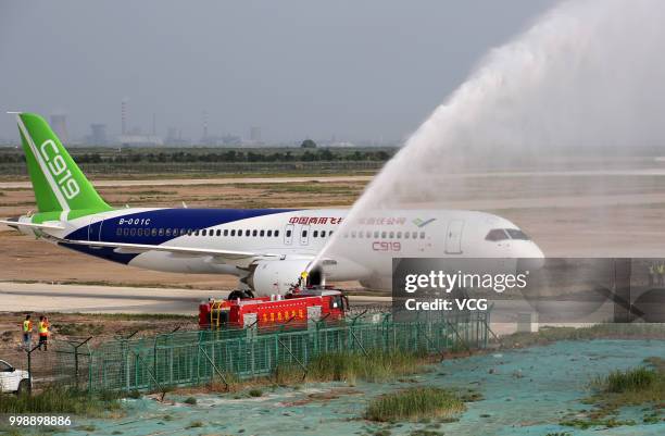 The No.102 C919 passenger jet lands at Dongying Shengli Airport on July 12, 2018 in Dongying, Shandong Province of China. Flying from the final...