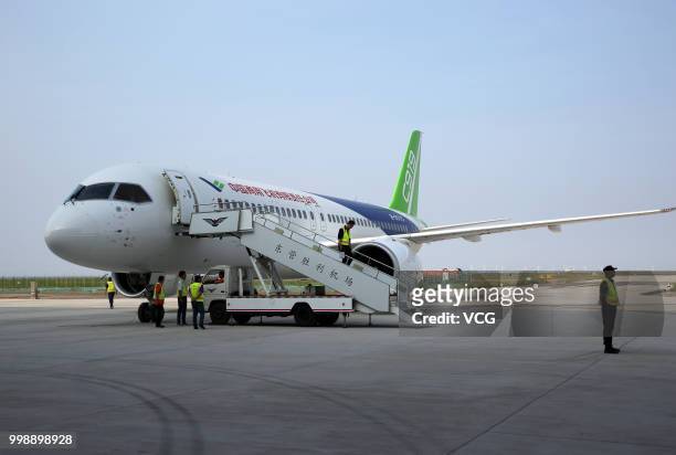 The No.102 C919 passenger jet lands at Dongying Shengli Airport on July 12, 2018 in Dongying, Shandong Province of China. Flying from the final...