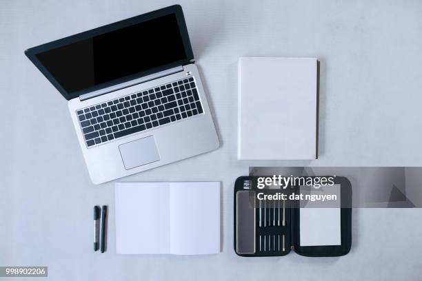 flat lay. top view workspace with laptop, notebook, diary, pencil case and pens on white fabric... - flat top stock pictures, royalty-free photos & images