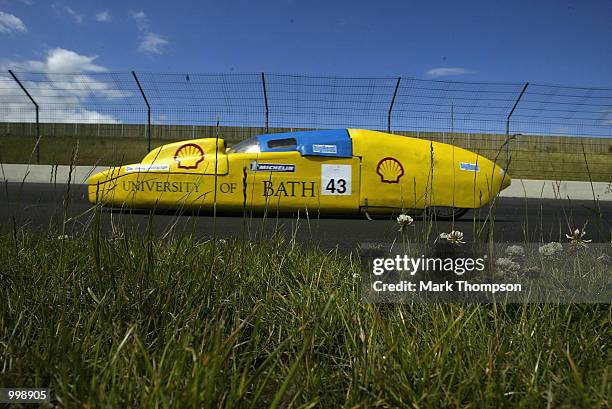 Competitors in action during the Shell Eco Marathon event at the Rockingham Motor Speedway in Corby on July 11, 2002. The cars were competing to beat...