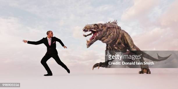 businessman in suit with monster creeping chasing him - greedy smith 個照片及圖片檔