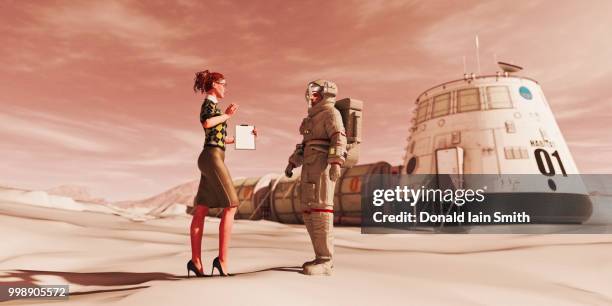 woman with clipboard talking to astronaut in red desert landscape - astronaut hand stock pictures, royalty-free photos & images