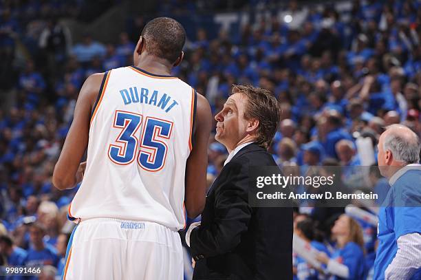 Kevin Durant of the Oklahoma City Thunder speaks with head coach Scott Brooks during the game against the Los Angeles Lakers in Game Six of the...