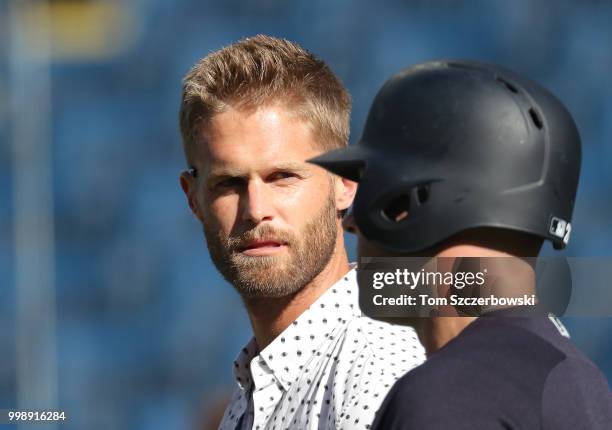 Former Canadian player and current radio co-host Chris Leroux talks to Austin Romine of the New York Yankees during batting practice before MLB game...