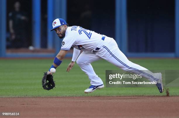 Devon Travis of the Toronto Blue Jays dives but cannot get to a single hit by Brett Gardner of the New York Yankees in the first inning during MLB...