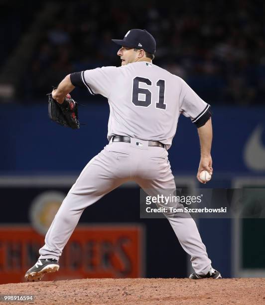 David Hale of the New York Yankees delivers a pitch in the eighth inning during MLB game action against the Toronto Blue Jays at Rogers Centre on...