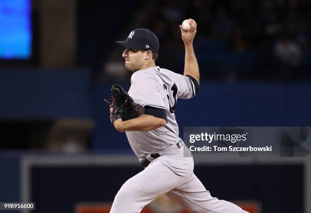 David Hale of the New York Yankees delivers a pitch in the eighth inning during MLB game action against the Toronto Blue Jays at Rogers Centre on...