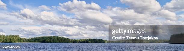 panorama landscape with dramatic cumulus clouds in the bright summer day scene in finland - teemu tretjakov stock pictures, royalty-free photos & images