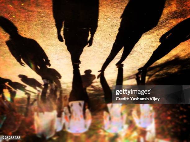 shadow mans... - vijay stock pictures, royalty-free photos & images