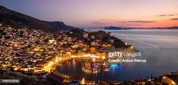 panorama of the beautiful sunset of hydra island, greece - anton petrus fotografías e imágenes de stock