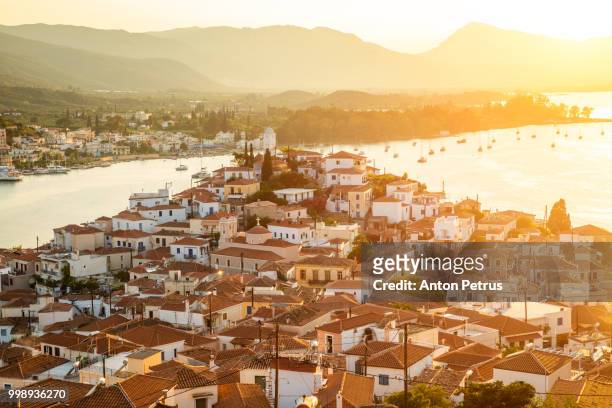 sunset on poros island in aegean sea, greece - anton petrus stock pictures, royalty-free photos & images