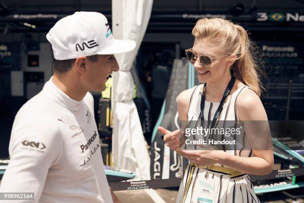 In this handout provided by FIA Formula E, Mitch Evans , Panasonic Jaguar Racing, Jaguar I-Type II, meets Natalie Dormer during the New York City...