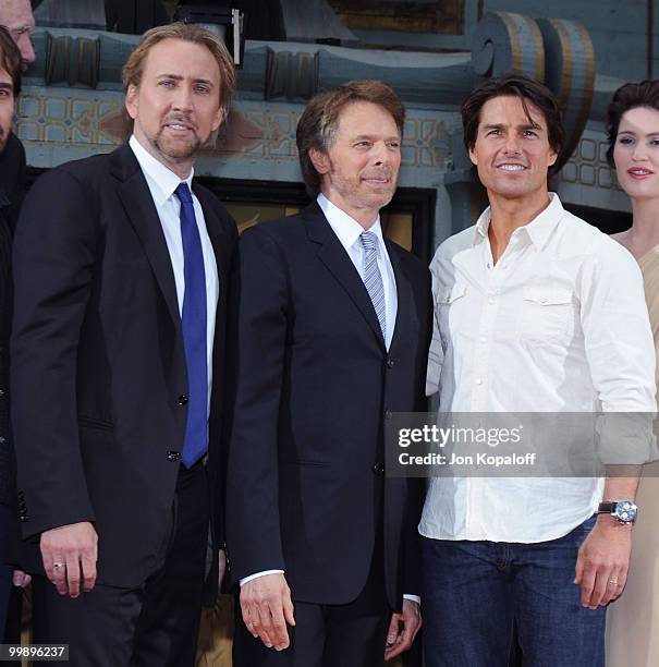 Actor Nicolas Cage, Jerry Bruckheimer and actor Tom Cruise pose at the Handprint And Footprint Ceremony Honoring Producer Jerry Bruckheimer at...