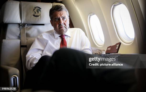 German Foreign Minister Sigmar Gabriel is talking to journalists on his flight to Uganda and South Sudan in an Airbus A319 airplane in the air space...