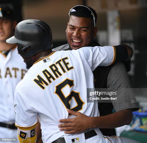 Starling Marte of the Pittsburgh Pirates celebrates with Ivan Nova after hitting a solo home run in the eighth inning during the game against the...