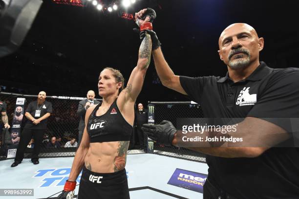 Liz Carmouche celebrates after defeating Jennifer Maia of Brazil in their women's flyweight fight during the UFC Fight Night event inside CenturyLink...