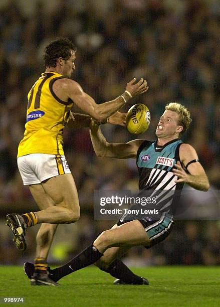 Nick Stevens of Port Power and Angelo Lekkas of Hawthorn in action in the semi final match between Port Power and the Hawthorn Hawks played at...