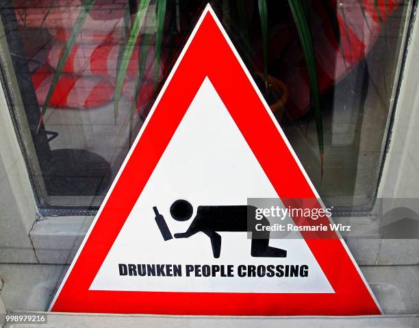 triangular warning sign: drunken people crossing - fall arrest stock pictures, royalty-free photos & images