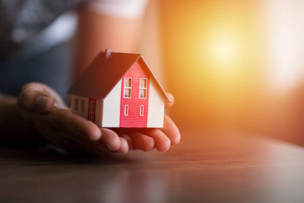The 28 Most Profitable Small Business Ideas in Ethiopia 5 business man hand hold the house model saving small house