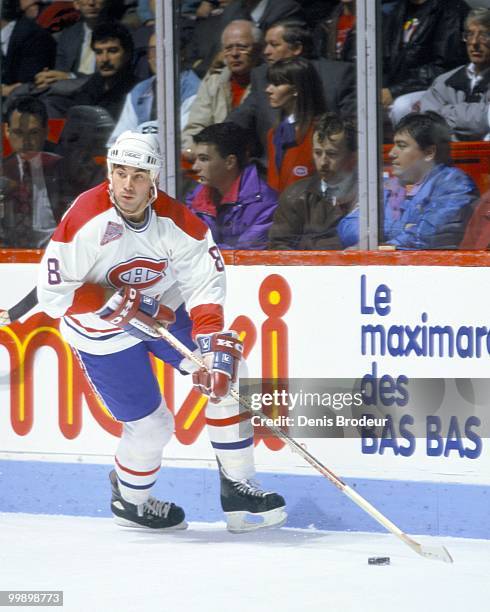 Mathieu Schneider of the Montreal Canadiens skates with the puck during the 1990's at the Montreal Forum in Montreal, Quebec, Canada. Schneider...