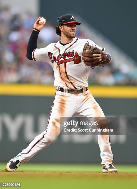 Dansby Swanson of the Atlanta Braves throws out a fifth inning runner against the Arizona Diamondbacks at SunTrust Park on July 14, 2018 in Atlanta,...