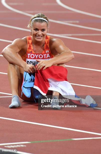 Dutch athlete Dafne Schippers celebrates her victory in the women's 200 metre running event final at the IAAF World Championships, in London, UK,...