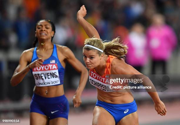 Dutch athlete Dafne Schippers crosses the finish line in first place during the women's 200 metre running event final at the IAAF World...