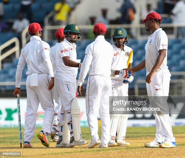 Abu Jayed and Taijul Islam of Bangladesh congratulate Shannon Gabriel of West Indies during day 3 of the 2nd Test between West Indies and Bangladesh...