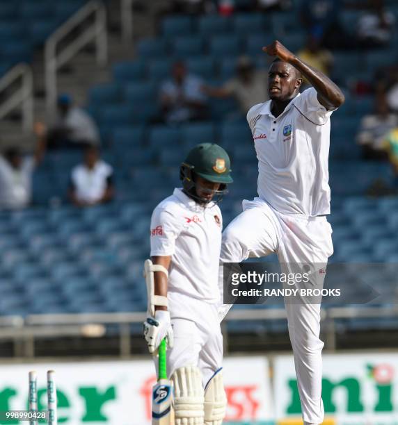 Jason Holder of West Indies celebrates the dismissal of Shakib Al Hasan during day 3 of the 2nd Test between West Indies and Bangladesh at Sabina...