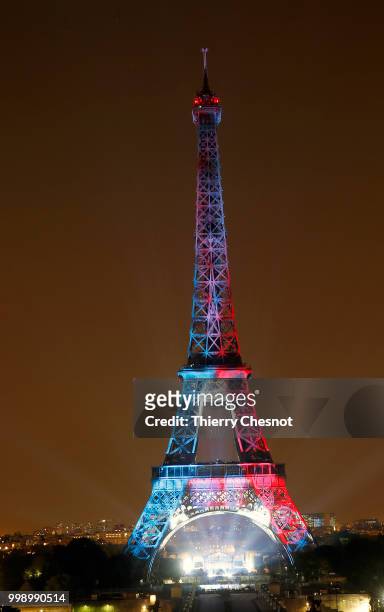 Blue, White and red lights illuminate the Eiffel Tower at the end of Bastille Day celebrations on July 14, 2018 in Paris, France. The theme of the...