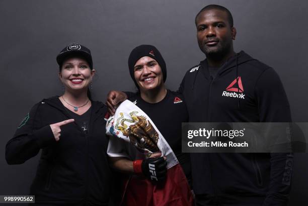 Jessica Aguilar poses with her corner for a post-fight portrait backstage during the UFC Fight Night event inside CenturyLink Arena on July 14, 2018...