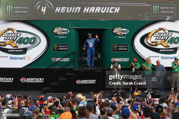 Kevin Harvick, driver of the Busch Light Ford, is introduced prior to the Monster Energy NASCAR Cup Series Quaker State 400 presented by Walmart at...