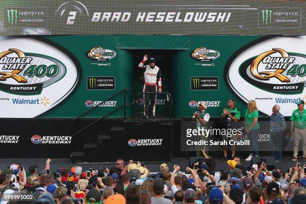 Brad Keselowski, driver of the Discount Tire Ford, is introduced prior to the Monster Energy NASCAR Cup Series Quaker State 400 presented by Walmart...