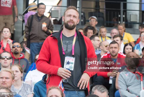 German discus thrower Robert Harting and his wife, Julia Harting, following the women's discus throw qualifier at the IAAF World Championships, in...