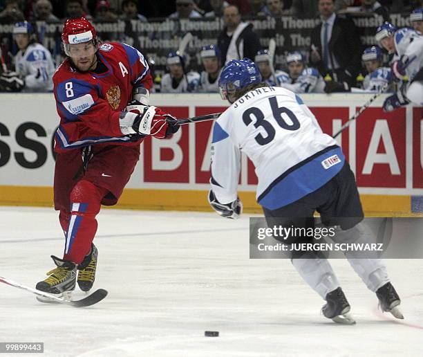 Russia's Alexander Ovechkin vies with Finland's Jussi Jokinen during the IIHF Ice Hockey World Championship match Russia vs Finland in the western...