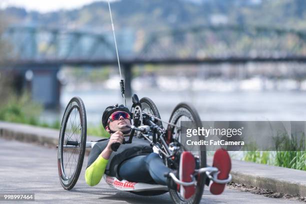 Adaptive athlete does a training ride on his handcycle